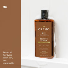Cremo 2-in-1 shampoo and conditioner bottle with bourbon vanilla label, water droplets