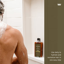 2-in-1 shampoo and conditioner bottle beside shower, foamy bubbles on skin