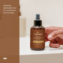 Beard conditioning mist bottle with black pump held in a hand