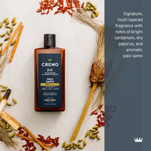 2-in-1 shampoo & conditioner bottle with Palo Santo label, shown with botanical accents