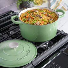Pistachio green dutch oven with lid, filled with stew, on a stovetop