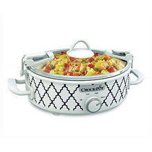 White and blue mini slow cooker with lid and visible casserole inside