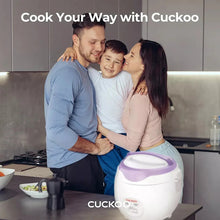 White and purple rice cooker on a kitchen counter