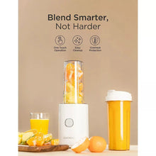 Personal blender with fruit-filled tall jar and yellow blending container