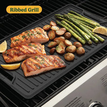 Cast iron ridbed grill plate with grilled chicken, asparagus, potatoes, and lemon halves.