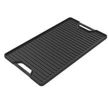 Cast iron reversible griddle plate with ridged grill surface and side handles.
