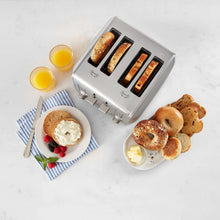 4-slice toaster with toasting slots, with bagel halves and bread pieces shown