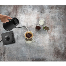 Cuisinart digital gooseneck kettle being poured, matte black, spout angled