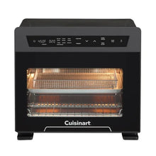 Cuisinart air fryer oven with glowing heating coils through the window