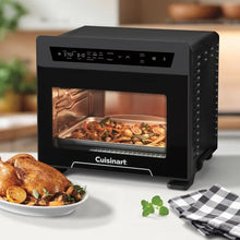 Cuisinart digital air fryer oven on countertop with roasted food inside