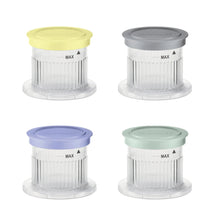 Four half-pint frozen treat cups with MAX lids in yellow, gray, blue, and green