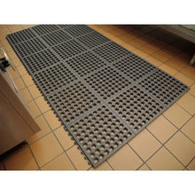 Modular floor mat tiles with circular holes, dark gray rubber, large rectangular pieces