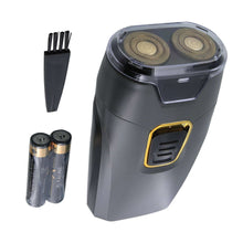 Dual rotary travel shaver with brush and two AA batteries, dark gray with gold accents