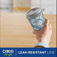 Insulated paper cup with leak-resistant lid, blue geometric print, held to drink