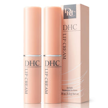 Two peach-pink DHC lip cream tubes with retail box, capped