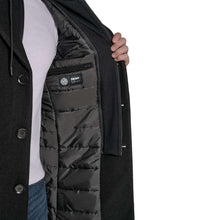 Men's black hooded coat lining with DKNY logo patch at open inner pocket