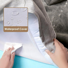 Grey dog bed with removable waterproof cover, fabric being wiped clean