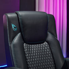 Black gaming chair backrest with emblem logo, textured center panel, and teal stitching