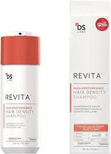 DS Revita hair density shampoo bottle, white with orange cap and label.