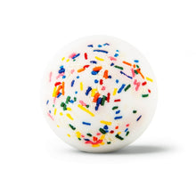 White spherical bath bomb with colorful sprinkle topping