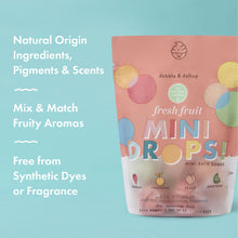 Mini bath bomb pouch, Fresh Fruit scent, showing fruit drop icons and logo.