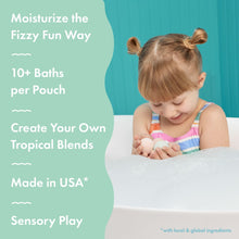 Child holding a mini bath bomb as bubbles fizz in the tub