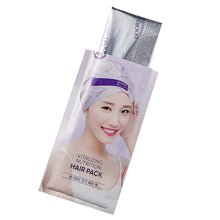 Hair pack sachet with model photo, purple logo and silver backing, angled view