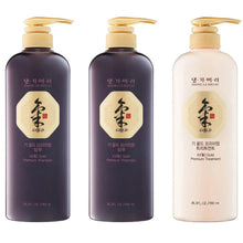Hair care set bottles with gold labels, dark purple and light cream, pump tops