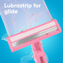 Pink razor head with lubricating strip on two blades