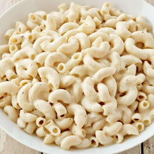 Elbow pasta coated in creamy white sauce, close-up view