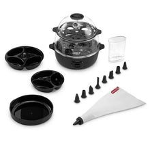 All-in-one egg cooker with clear lid, black egg cups, and funnel nozzles