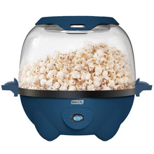 Blue ceramic popcorn maker with clear lid; popped popcorn inside base