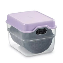 Mini waffle maker with lilac lid and transparent cover, black plate visible
