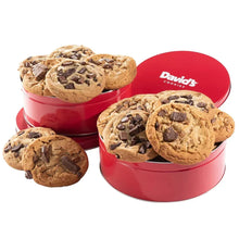 Cookie tin with three chocolate cookies and mini chocolate pieces, red lid