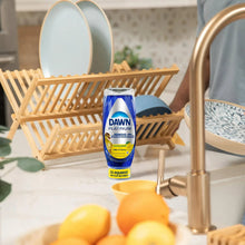 Dish soap squeeze bottle with blue Dawn Platinum Clean Lemon label.