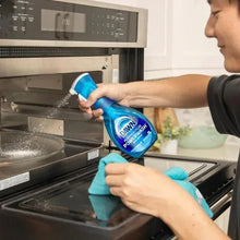 Blue Dawn Powerwash dish soap spray bottle dispensing over kitchen sink