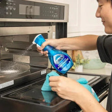Dish soap spray bottle pouring foam into a sink basin