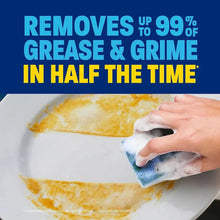 Dish cleaning with a sponge: soap bubbles lifting grease on a white plate