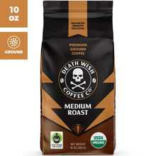 Ground coffee bag, medium roast, black with orange panels and skull logo
