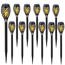 Assorted solar tiki torch lights, black stakes with gold flame-pattern lantern heads