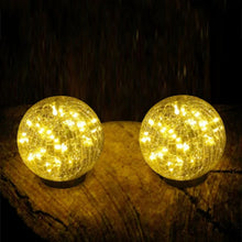 Crackle glass globe LED lights with warm yellow glow, two black stakes