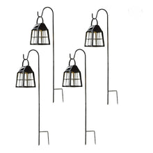Set of four black metal solar lanterns with stakes and hanging hook tops