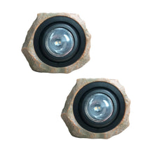 Solar rock landscape light with circular LED lens in rugged stone housing, black rim