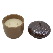 Brown ceramic candle holder with cream wax and dark brown textured lid