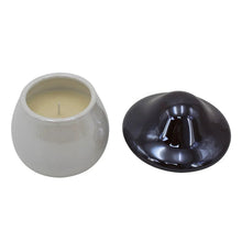 White ceramic candle holder with cream wax and dark gray dome lid