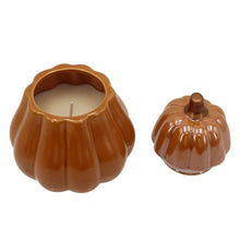 Orange ceramic pumpkin candle holder with cream wax and matching lid