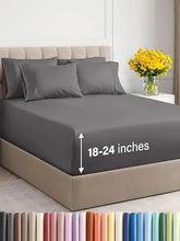Gray deep-pocket fitted bed sheet set with pillowcases on a bed with pillows