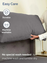Gray fitted bed sheet set with pillowcase, shown lifted by a hand