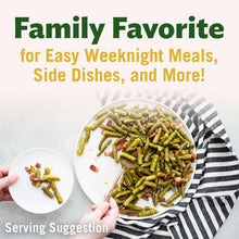 Green bean side dish in a bowl with small bits, served with striped napkin.