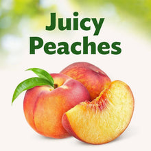 Sliced peach fruit with whole peaches and green leaves